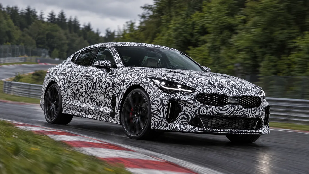 Camouflaged prototype cornering on the Nürburgring